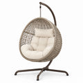 Sillón colgante de ratán sintético beige con estructura de acero